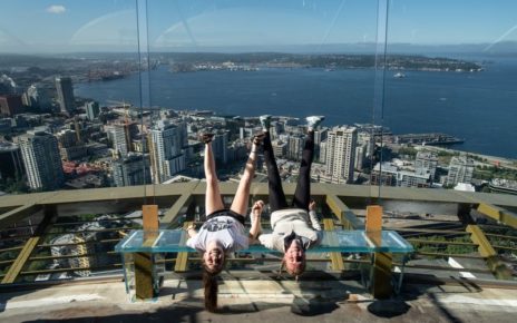 Two people upside down on space needle