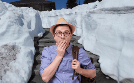 Man covers mouth with snow background