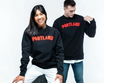 Man and woman wearing Portland shirts