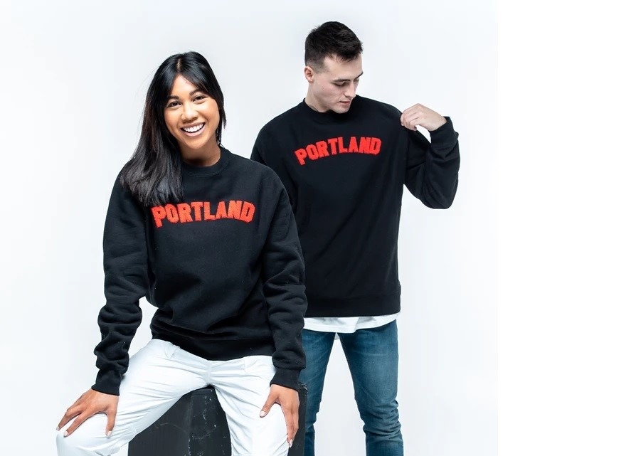 Man and woman wearing Portland shirts